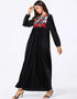 Midnight Bloom: A Cascading Black Abaya Embroidered with Golden Foliage