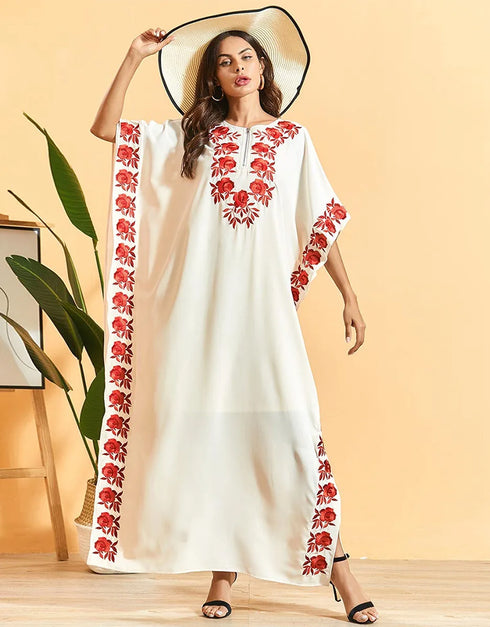 Embrace Bohemian Breezes: Embroidered Batwing Abaya with Flowing Pleated Skirt