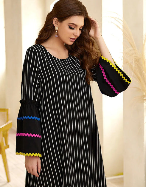 A Long Skirt Where Stripes Sing and Embroidery Dances