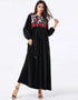Midnight Bloom: A Cascading Black Abaya Embroidered with Golden Foliage