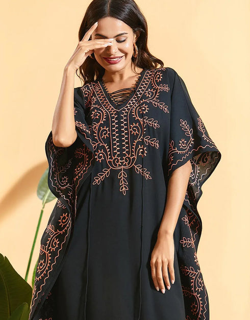 Embrace Bohemian Breezes: Embroidered Batwing Abaya with Flowing Pleated Skirt