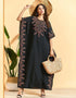 Embrace Bohemian Breezes: Embroidered Batwing Abaya with Flowing Pleated Skirt