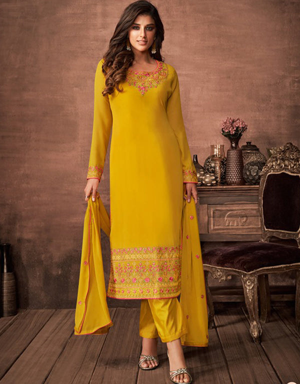 Yellow Pant style Suit Faux Georgette Salwar Kameez in Embroidery, Stone & Lace Work