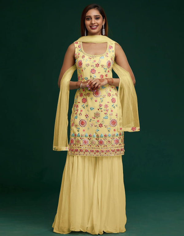 Yellow Sharara style Suit Faux Georgette Salwar Kameez in Embroidery, Mirror & Lace Work