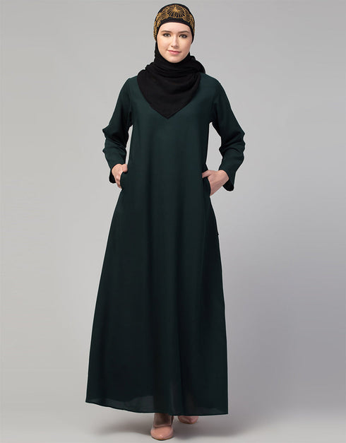 Muslim Basic abaya with a flared hem for a relaxed and stylish look In Color bottle green