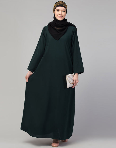 Muslim Basic abaya with a flared hem for a relaxed and stylish look In Color bottle green